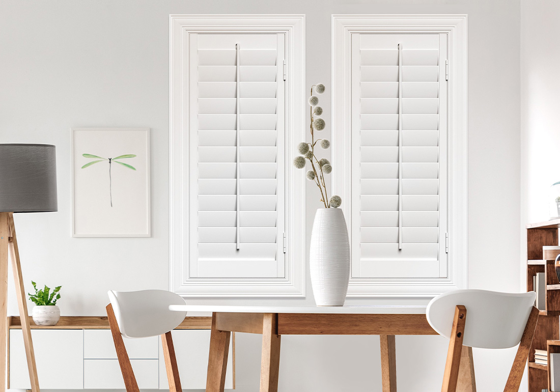 White plantation shutters in a kitchen.